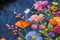 background-floral-embroidery-top-denim-fabric_58460-27506